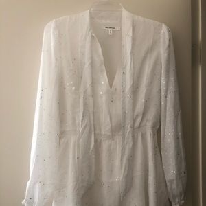 White long sleeve dress with silver dashes.